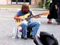 Awesome bassist playing and singing on the street