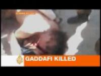 Żołnierze ciągnęli zakrwawione ciało Kadafiego po ulicy Dramatic Video (+18) 