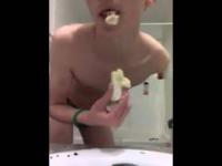 Young boy shows how to do blowjob on banana in a strange way