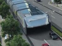 Futuristic straddling bus allows cars running underneath